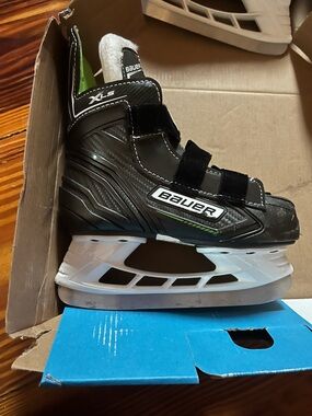 Bauer Kids Black Skates with White Holders and Green Accents